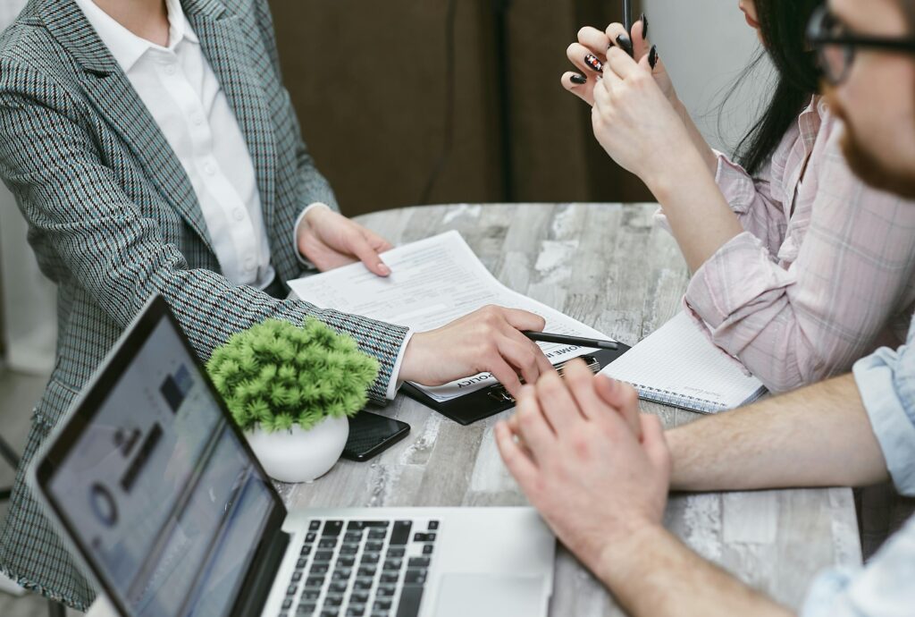 Professional Home Loans team consulting with clients