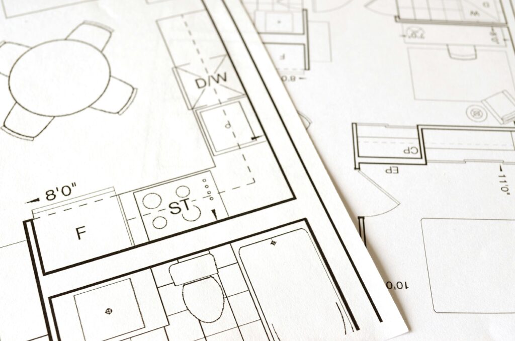 Architectural blueprint showing a kitchen, dining area, and bathroom layout with detailed measurements and labels